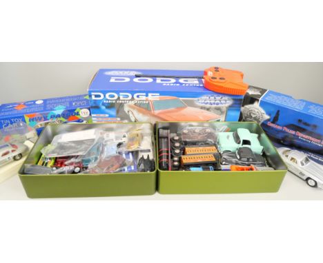 A collection of die-cast vehicles and a remote controlled car including Dodge, Hot Wheels, Corgi police car and tin toy car