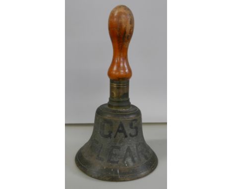 A WWII brass handbell with large broad arrow 