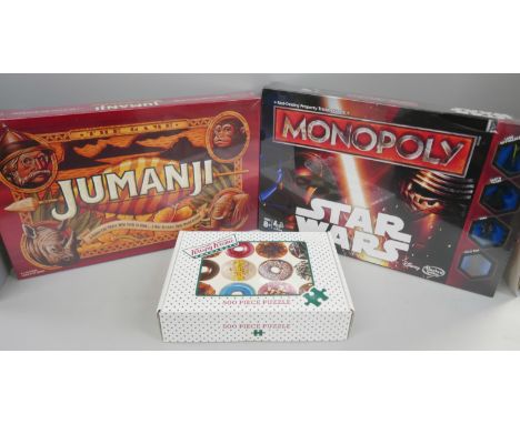 A Star Wars Monopoly set, Jumanji board game, both sealed and a Krispy Creme Doughnuts 500 piece puzzle