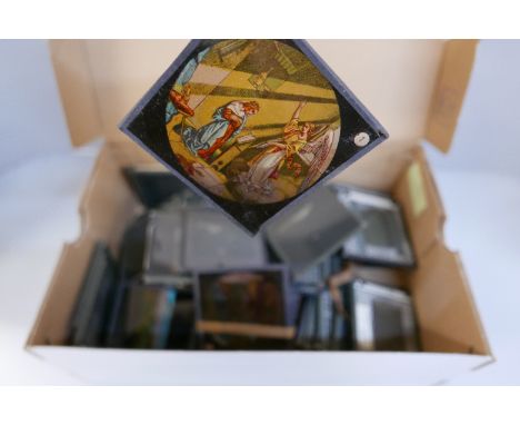 A box of lantern slides, mainly black and white scenic views but also some coloured