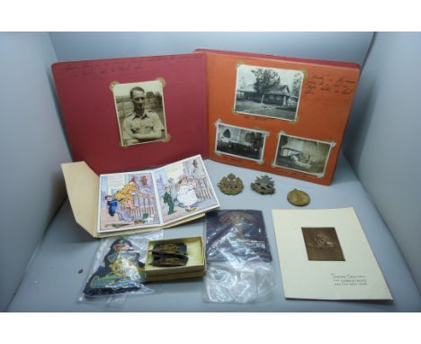 A WWII photograph album together with a collection of military badges, a WWI Victory medal to 203724 Pte. W. Turner, Notts &a