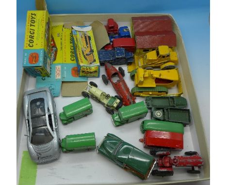 Die-cast model vehicles including two Matchbox garages, three Matchbox removals vans, two empty Corgi Toys boxes and one Matc