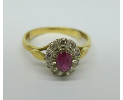 An 18ct gold, ruby and ten stone diamond ring, 3.8g