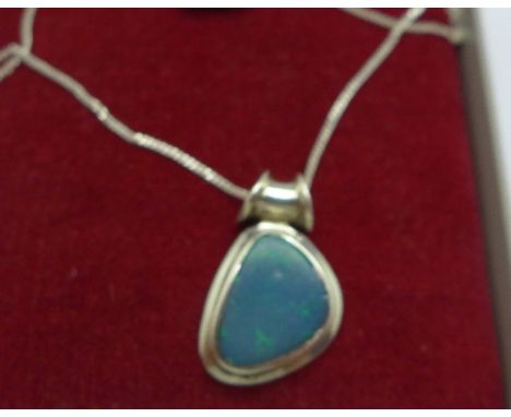 A silver and opal pendant and chain, boxed