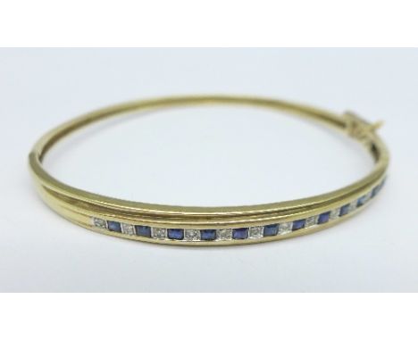 A 9ct gold bangle, with diamonds and sapphires, 8.8g
