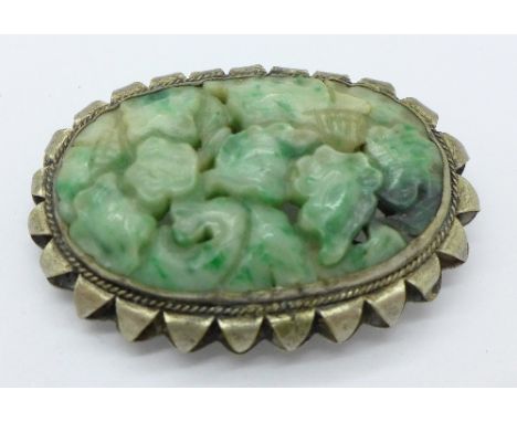 A Chinese carved jade scarf clip, marked, 'China', 46mm