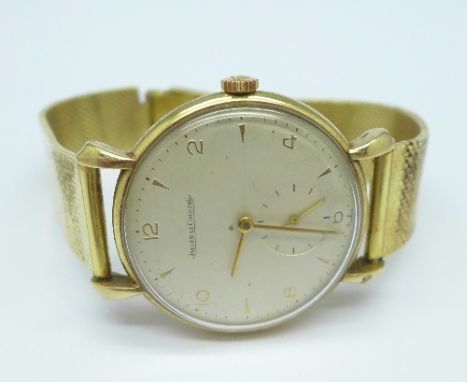 A 9ct gold cased Jaeger LeCoultre wristwatch on an 18ct gold strap, weight of strap and bezel without movement and case back 