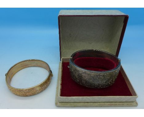 A boxed silver bangle, 42g, and a 1/5th 9ct rolled gold bangle