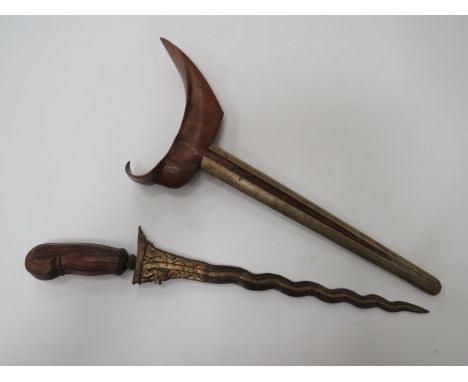 Fine 19th Century Wavy Blade Malayan Kris14 1/2 inch, heavy Damascus, wavy, double edged blade. Central brass overlay extendi