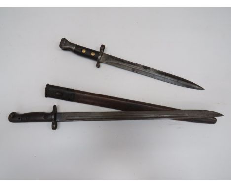 1907 SMLE Bayonet and M1888 Metford Bayonetconsisting SMLE bayonet.  17 1/4 inch, single edged blade with fuller.  The forte 