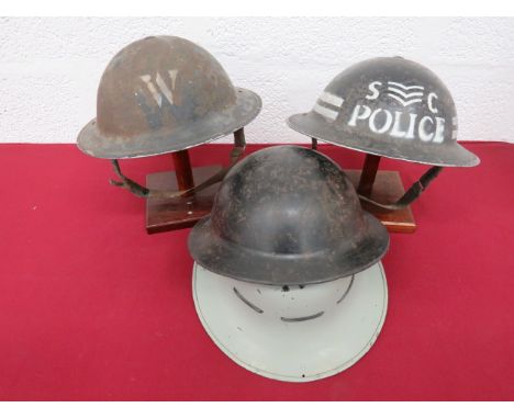 Three Various MKII British Steel Helmetsconsisting black painted example with white “S C Police” and Sergeant badge to front.