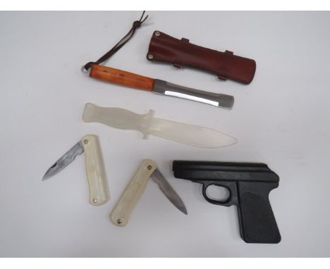 Parachutist Rigging Knife5 1/2 inch, double edged blade with blunt rounded tip.  Wooden slab grips secured by 3 brass rivets 