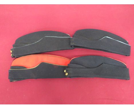 Four WW2 Coloured Field Service Capsconsisting Officer’s example.  Red crown and body.  Dark blue curtain, all with gilt pipi