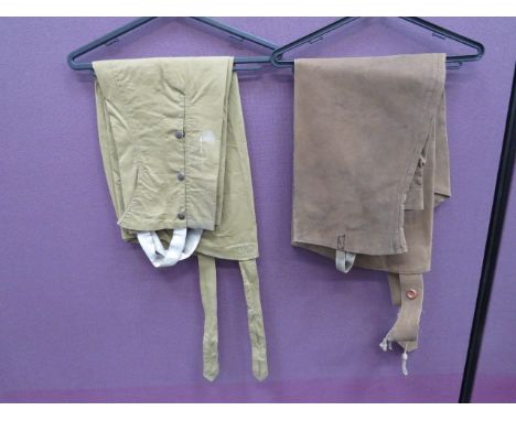 Two Pairs of Dispatch Rider Over Leggingsconsisting pair of dark tan, waterproof canvas leggings.  Top joining straps.  Lower