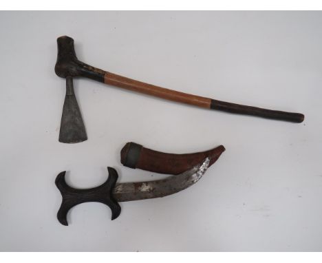 African Knife and Axeconsisting 7 1/2 inch, double edged, slightly curved blade knife.  Fluted wooden grip.  Contained in its