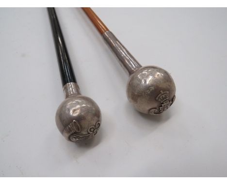 Two Silver Topped Swagger Sticksconsisting silver hallmarked B’ham 1970, bulbous top with strung bugle “Rifles” badge.  Black