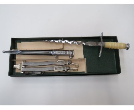 East German Junior Officer’s Dagger9 3/4 inch, polished wavy, double edged blade.  Chrome plated S shape crossguard terminati