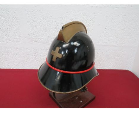 Swiss Fire Brigade Helmetblack painted steel crown.  Lower brim with steel edging.  Brass top comb.  Brass front cross badge.