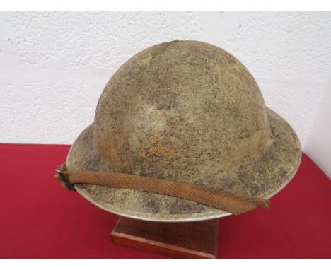 WW2 British Africa Campaign Painted Steel Helmetlight sand, rough texture, overpainted steel helmet.  The front with traces o