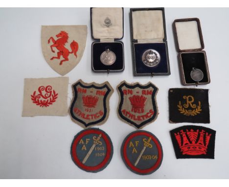 Small Selection of Sporting Medals and Badgescased medals including silver KSLI 1931 hockey medal to “Pte W Bailey” ... Silve