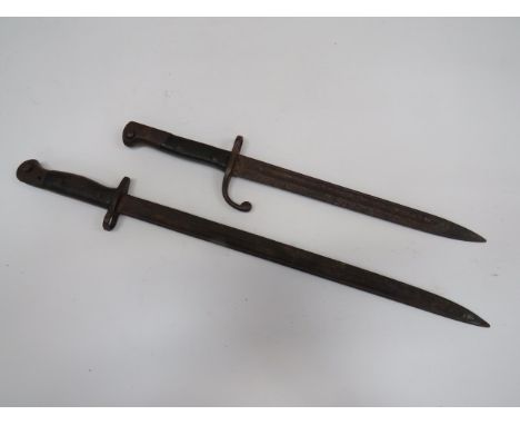 British SMLE Bayonet and a Mauser Contract Bayonet17 inch, single edged blade with central fuller.  British Ordnance stamps t