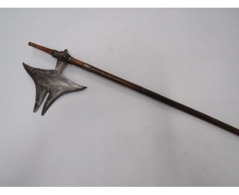 19th Century Indian Axesteel stingray shaped, double pointed head.  Chiselled joining mount.  Polished wooden shaft with stee
