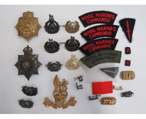 Small Selection of Royal Marines Badgesincluding KC silvered, gilt and enamel RM Officer’s helmet plate.  Tarnished. (3 rear 