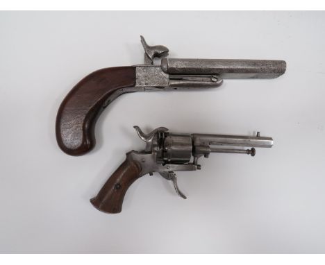 Two 19th Century Continental Pinfire Pistolsconsisting 11 mm, 4 3/4 inch octagonal side by side, double flip up barrels.  Fla