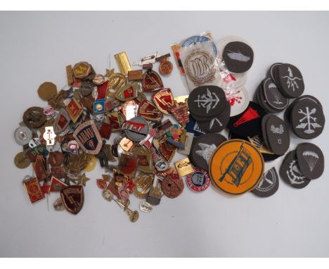 Good Selection of East German Badgesincluding DDR Sports ... Shooting ... Police Sports ... Gilt and enamel Motorsport car ba