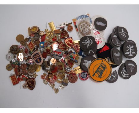 Good Selection of East German Badgesincluding DDR Sports ... Shooting ... Police Sports ... Gilt and enamel Motorsport car ba