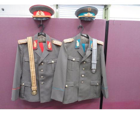 Two High Ranking East German Officer Uniformsconsisting Army Officer’s example with red backed, red and gilt collar badges.  