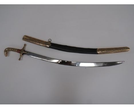 20th Century Arabian Mameluke Sword26 1/2 inch, slightly curved, polished steel blade.  Cast brass crossguard and grip with g