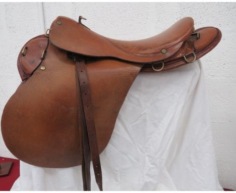 British Officer’s MKV Saddlelight brown leather saddle and side flaps.  Brass securing loops.  Interior padded leather flaps 