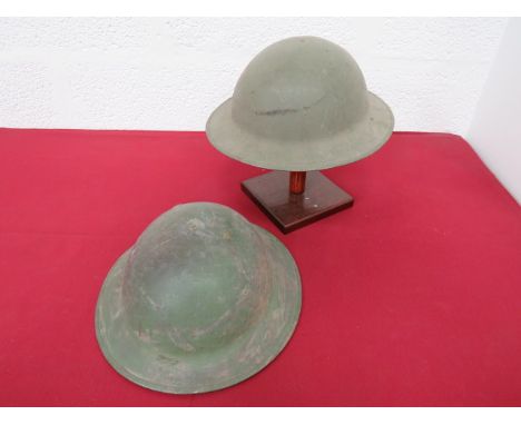 Two WW1 American Pattern Brodie Helmet Shellsconsisting green painted, rough texture, low crown helmet.  Turned edge brim.  F