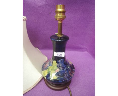 A Moorcroft table lamp in Anenome pattern on blue ground with shade