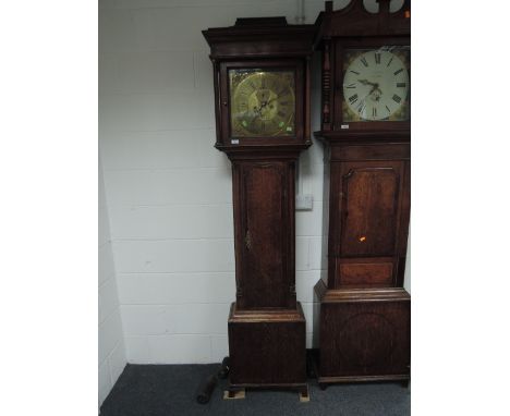 A late 18th century oak longcase clock having square pillar hood containing brass dial and eight day movement by J Standring,