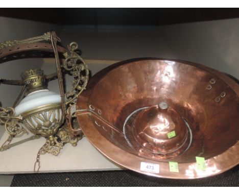 A vintage copper pan, a copper posser head and a brass frame ceiling oil lamp