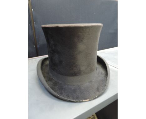 A vintage top hat by A Ashworh, hatters Bury, internal diameter 21.5' and 6' tall