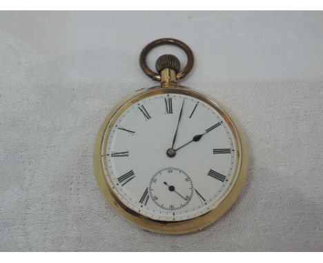 A yellow metal top wound pocket watch stamped 18K having a Roman numeral dial with subsidiary seconds on a white face to case