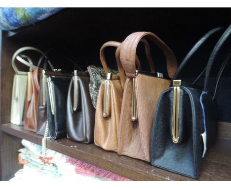 A large lot of vintage handbags, ranging from 30's to 60's aprox, some beautiful designs and styles, some with tags attached