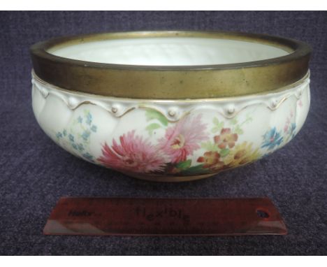 A Royal Worcester bowl having painted floral decoration on buff ground, having metal rims, numbered 1739