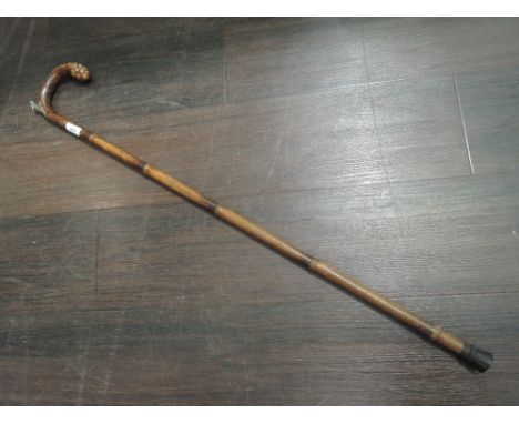 A Victorian design equestrian walking stick having HM silver band engraved for S Sturgeon, 36 Merton Road, Bootle, with hidde