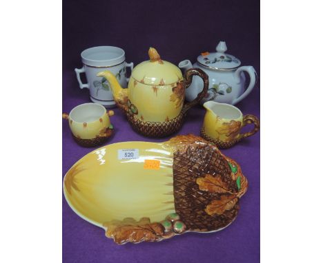 A mid 20th century tea service by Burgess &amp; Leigh in the Burleigh ware Acorn design and a Royal Worcester teapot and stra