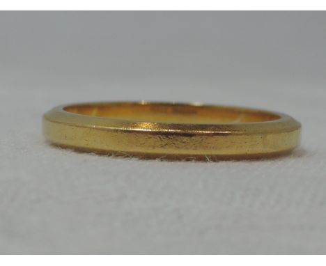 A 22ct gold wedding band having chamfered edges, size R &amp; 5.6g