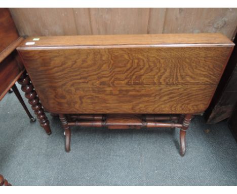 A late Victorian oak sutherland dining/occasional table having traditional drop flap on turned frame gate legs