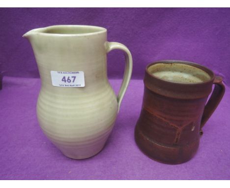 A 20th century St Ives pottery jug by Bernard Leach of ribbed form having seal mark and signed and dated August 1950 (from Le