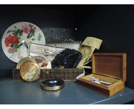 A selection of vintage compacts, two evening bags, a wooden box of hat pins, a few broaches and stick pins etc