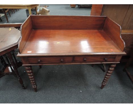 A mid Victorian mahogany washstand having raised back with two frieze drawers on bobbin legs