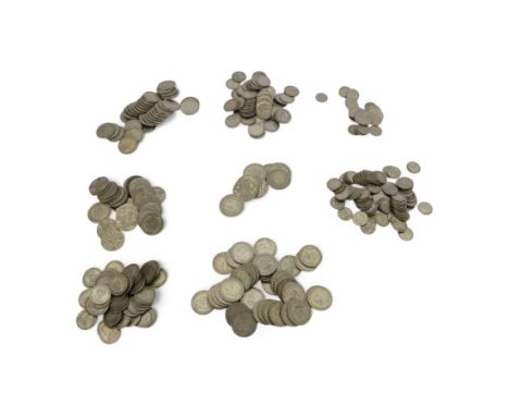 Approximately 2220 grams of pre 1947 Great British silver coins, including sixpences, shillings, florins or two shillings and