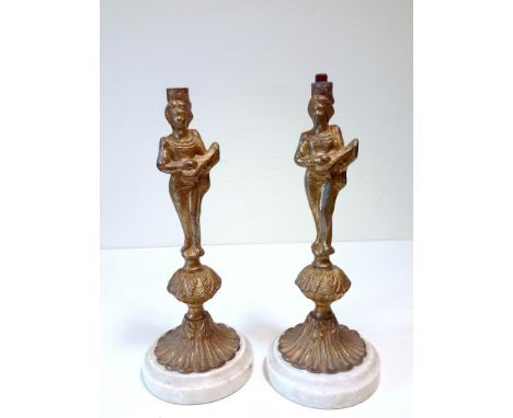 A pair of 19thC marble mounted gilt figurines originally gas light bases.